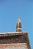 Ladakh - Sankar Gompa (Leh), projecting roofs in deep red 